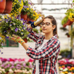 Is It Time to Move on from Your Business? Young hardworking female nursery garden worker