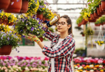 Is It Time to Move on from Your Business? Young hardworking female nursery garden worker